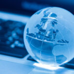 the business concept of the glass world on a laptop